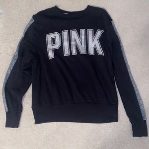 Black sweatshirt from PINK with glittered logo on the front.